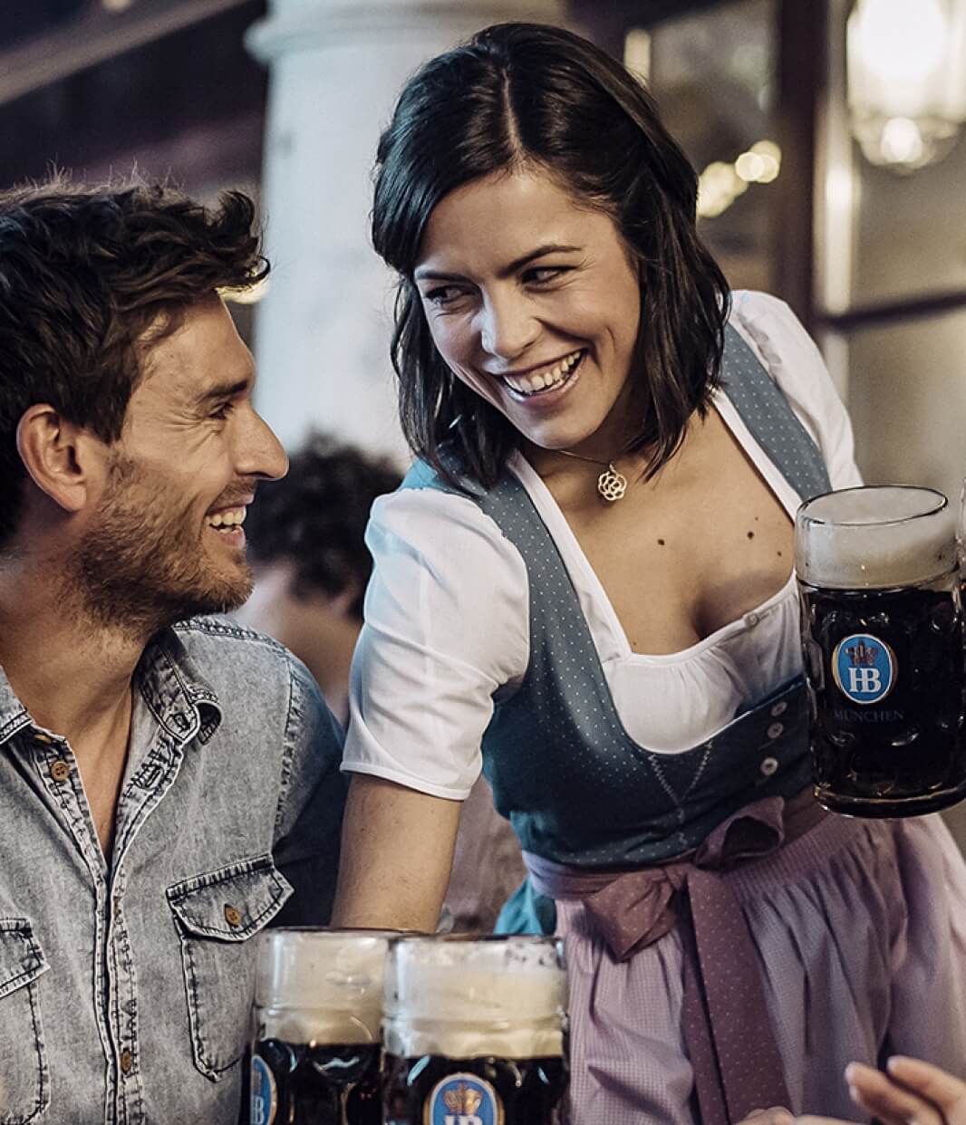 Smily girl serving hofbrauhaus beer